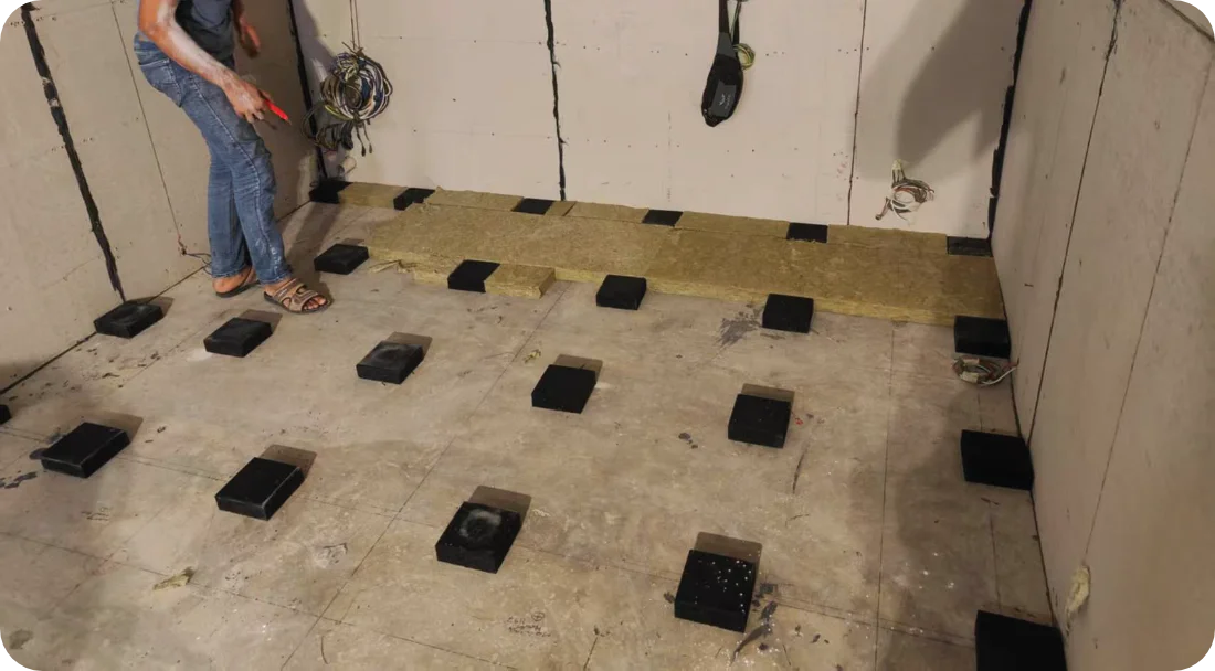 SG-FD150 floor damping blocks installed in grid layout