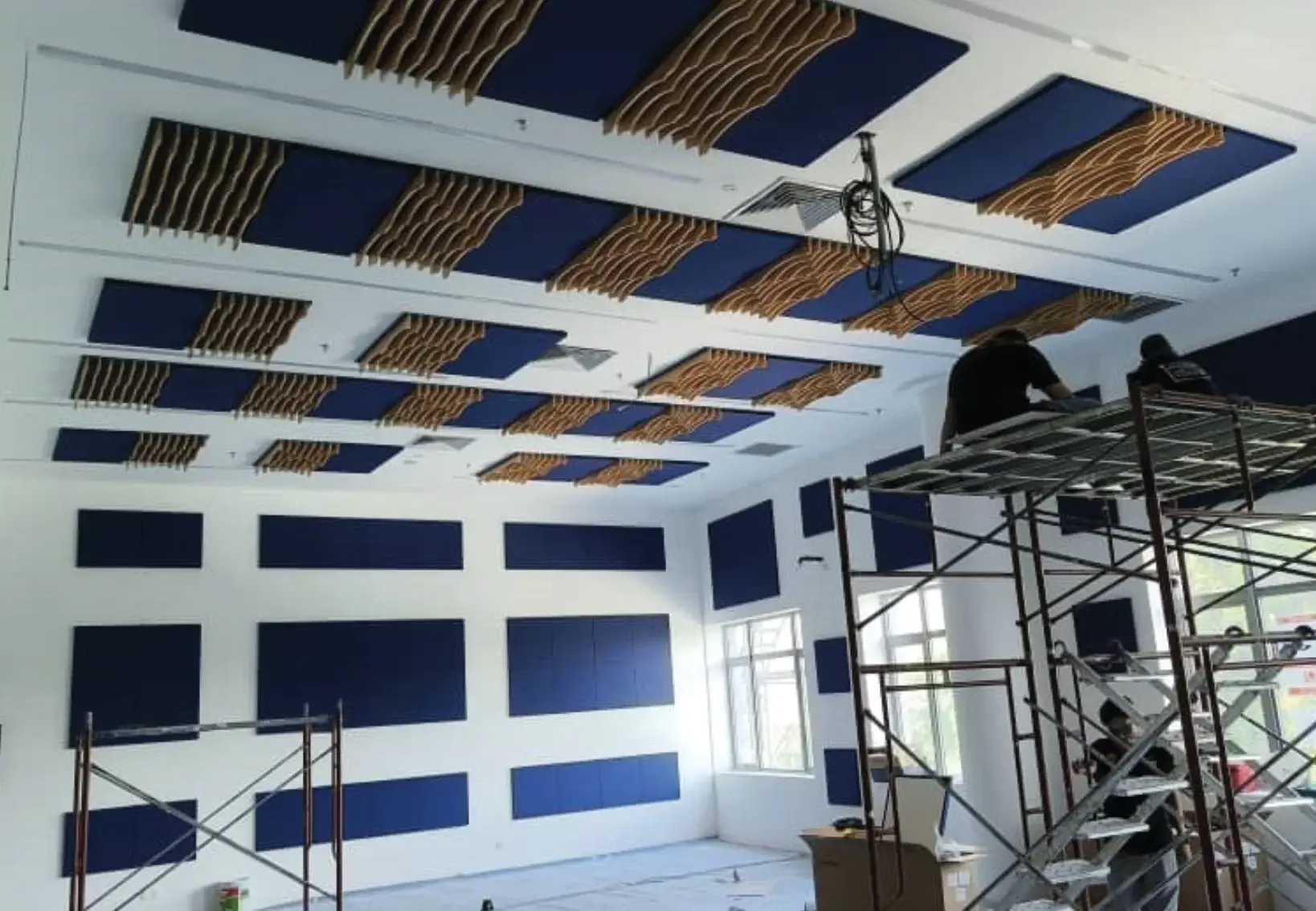Wall insulation treatment in ISKL middle school bandroom